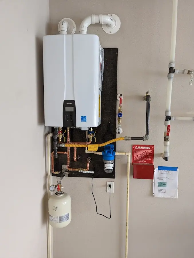 Professional plumber installing copper piping in a Coachella home